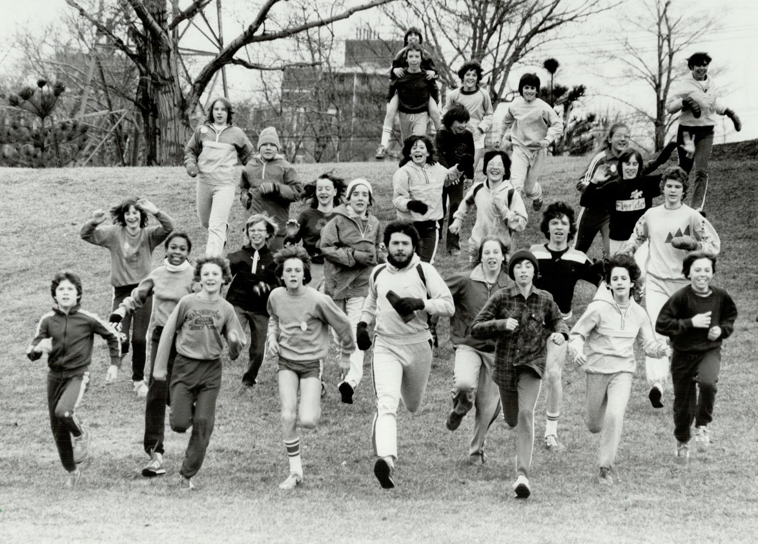 Leads the way: Teacher Ed Rogan leads his students from Our Lady of Sorrows School in Etobicoke through a run during their lunch hour.