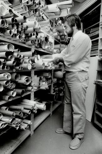 Sifting through clues: Victor Russell, manager of the archives at City Hall, sorts through some maps and plans.