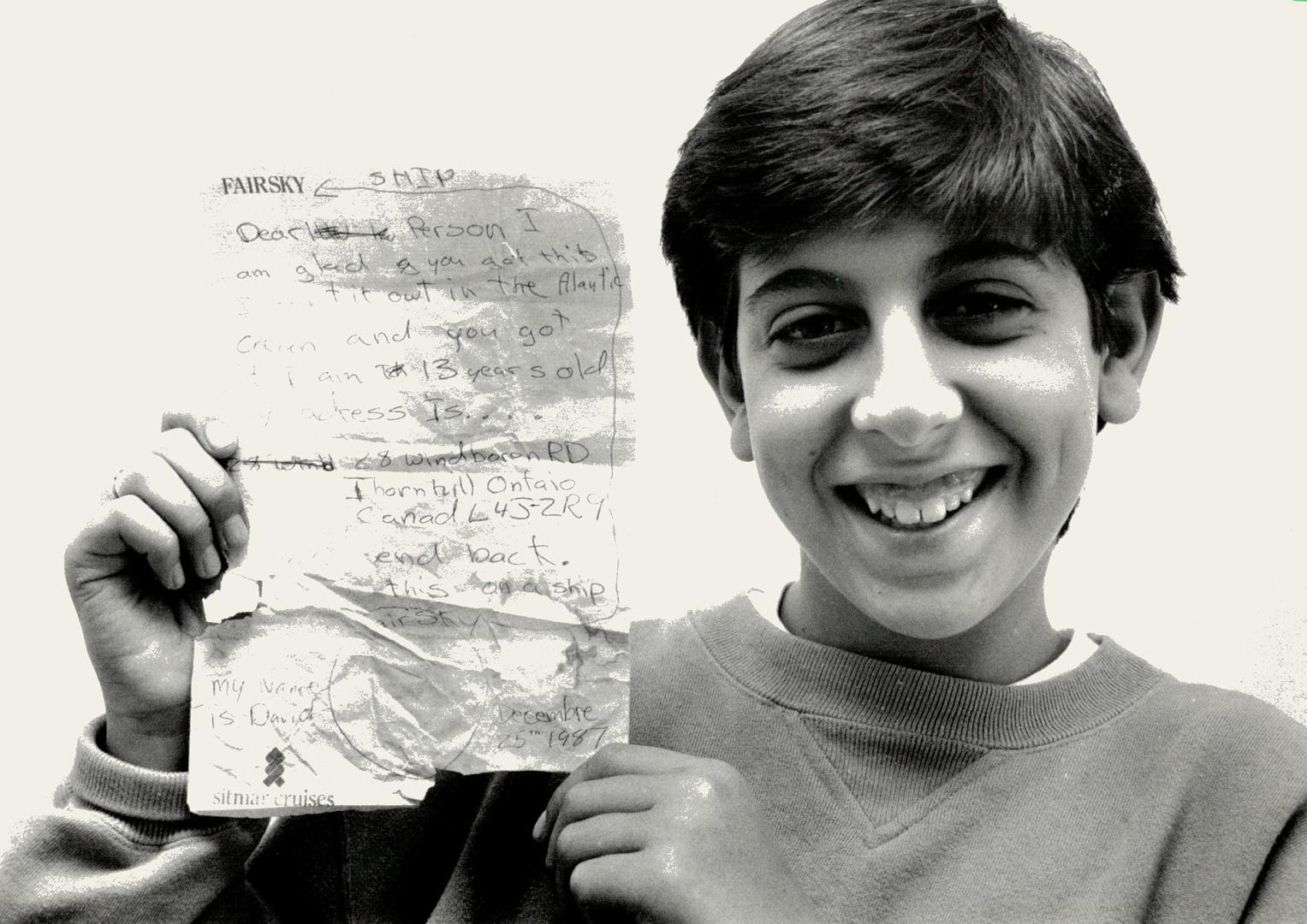 Message in a bottle: David Romeo, 13, of Thornhill, proudly displays the message he bottled and dropped into the Atlantic Ocean from a cruise ship off the northern coast of South America on Christmas Day