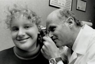 All clear: Dr. Dov Rotenberg checks Stephanie MacGregor, who suffered ear infections for seven years.