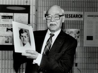 Lucky Patient: Ted Ryder, 74, holds a picture of himself showing the healthy boy he became after Dr. Frederick Banting started him on insulin treatments in 1922.