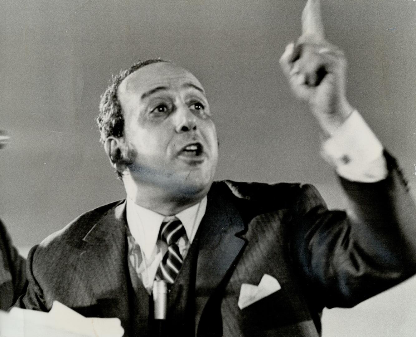 Defending the Arab position, Ibrahim Shukarllah, director of the Arab Information Centre in Ottawa, gestures during an unruly meeting on the Middle East at Timothy Eaton Memorial United Church