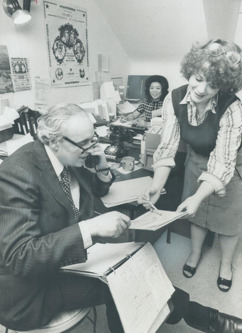 Neil Sneyd and his busy office staff. They're planning activities for the 300 members of the Hiatus Club