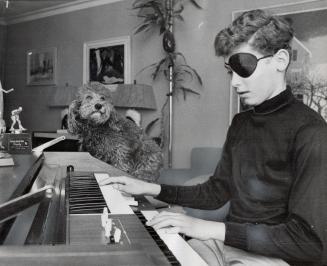 Getting in Parctice: Steve Sexton, age 12, works out a electric organ