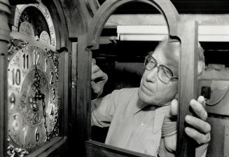 Loving care: Jacob Smith, above with a clock he started work on before Christmas, designs clock cases and often makes his own parts.