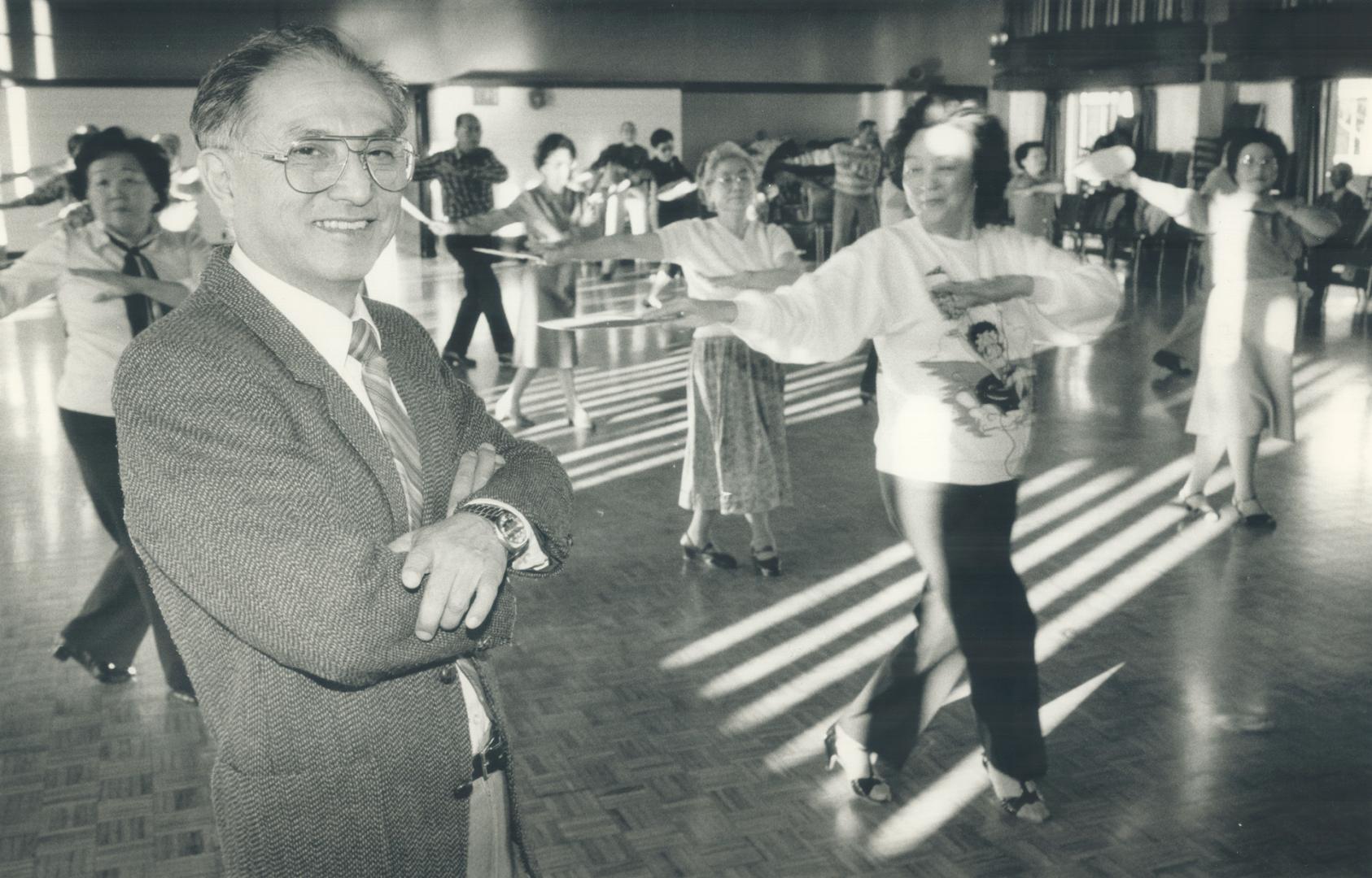 Meeting place: Kunio Suyama, administrator at the Japanese Canadian Cultural Centre, watches a group of seniors at a dance class at the centre