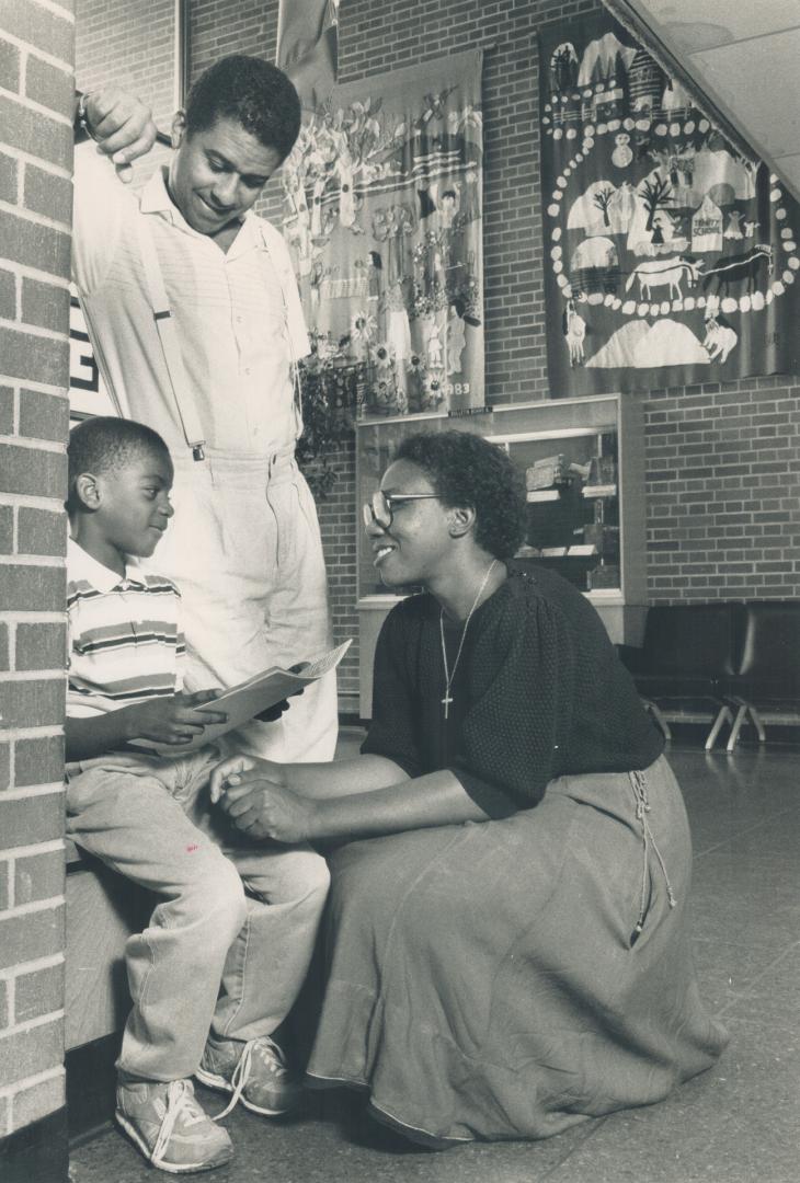 Encouraging words: Randy Mills, left,talks with Linda Morowei and Sheldon Taylor of the Jane Finch Concerned Citizens Organization.