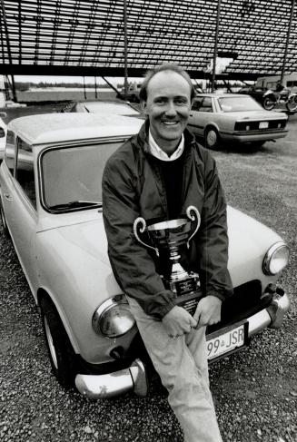 Champ's smile: Warren Spagn shows off his Wheels trophy after narrowly winning the challenge