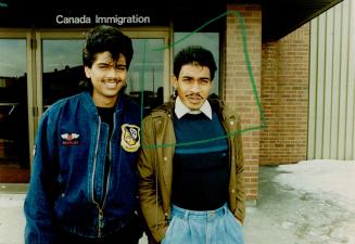 Facing ouster: Richard de Souza, 19, left, and Everard Sookharry, 26, had cases adjourned after appearing briefly at an immigration hearing in Metro yesterday