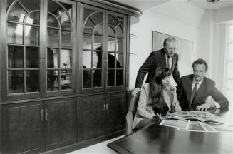 Wood Rich president Paul Stary, far right, Brian Sainek, vice-president, and Amriti Gill, regional manager, consult in their Toronto showroom