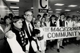 Warm welcome: Dragoljub Stavrev, president of the Macedonia republic, found John Fusis, 13, Chris Dimovski, 13, and Sofi Blazeski, 10, among the 250 at Pearson airport to greet him