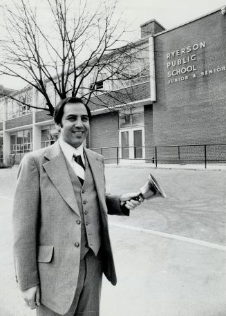 Louis Tepperman rings the bell outside Ryerson Public School. He says Mel Lastman fingered him for stealing a tuning fork in Grade 4.