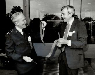 Ribbon cutting: Premier David Peterson, right, and Major Harold Thornhill, executive director of the hospital, beam as they open the Salvation Army's 10th Canadian hospital