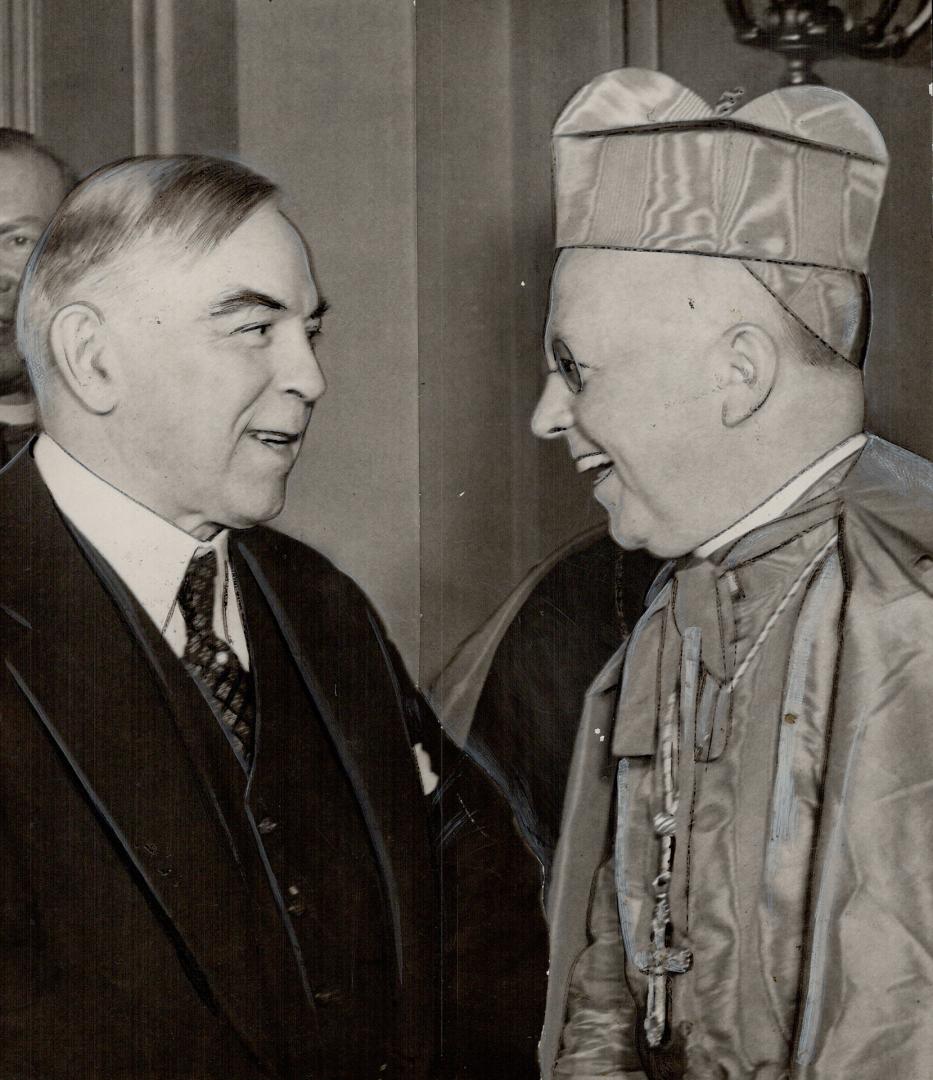 Men of Goodwill can surely unite in the common ground of Church and state to bring justice and peace to the world, said Prime Minister King, here with Cardinal McGuigan, as he spoke at the opening session of the Marian Congress in Ottawa