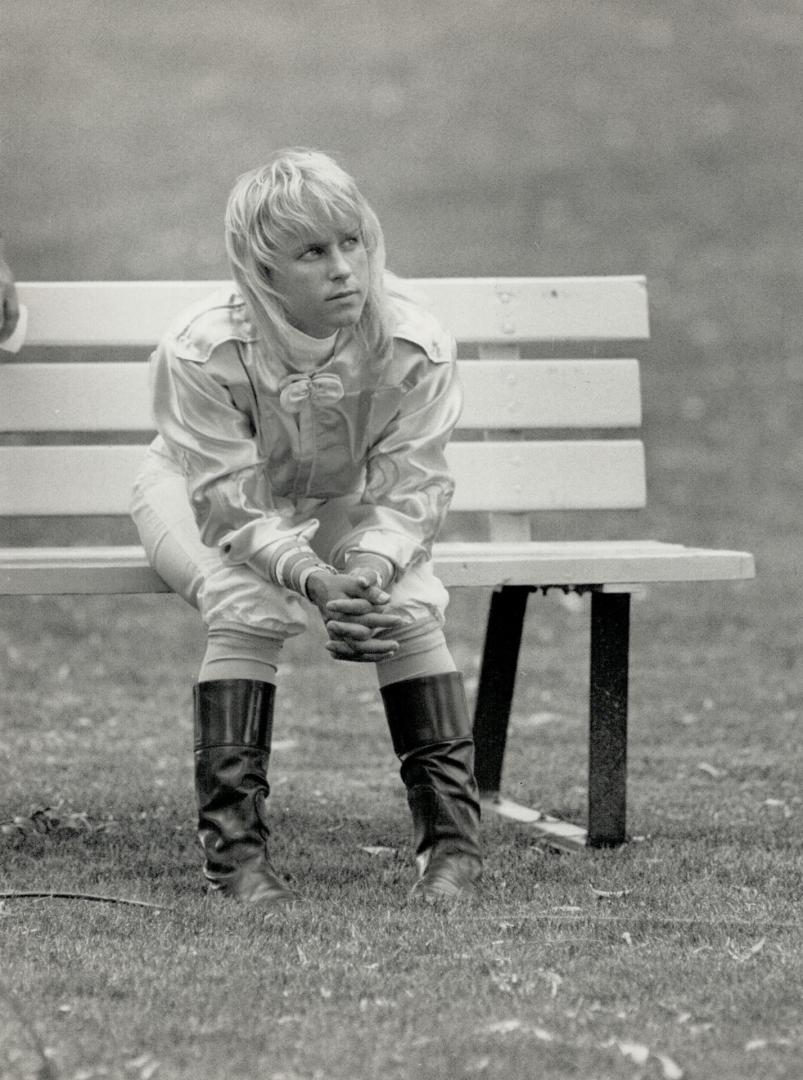 Krone...alone: Rider Julie Krone, the first female Plate jockey, collects her thoughts before yesterday's race. She rode No Malice to a fifth-place finish.