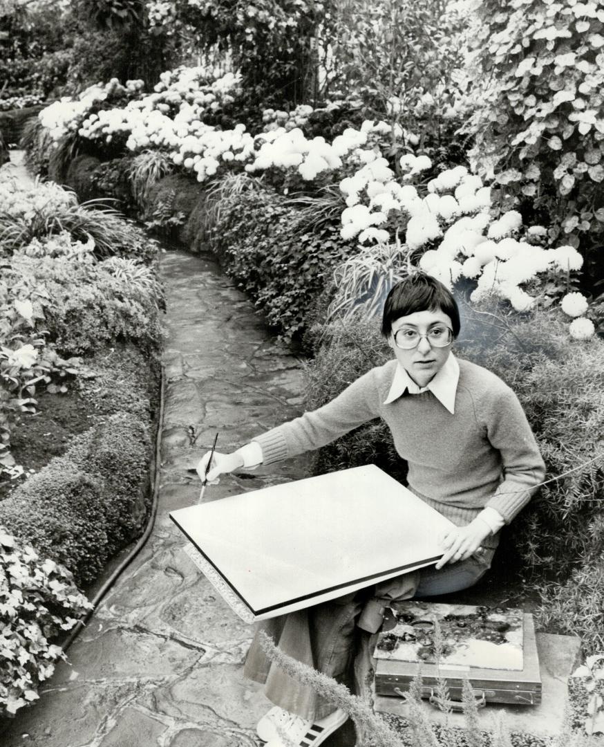 Artist Karen Kulyk brushes up on nature during a lunchtime break at Allan Gardens