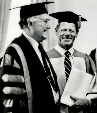 Honorary degree: Chancellor George Ignatieff, left, presented controversial theologian Hans Kung with an honorary Doctor of Laws degree yesterday on behalf of the University of Toronto