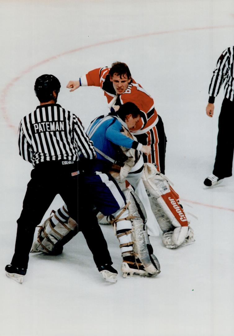 Fight night: Last night's slugfest at the Gardens featured The Battle of the Goalies - New Jersey's Sean Burke (top) vs