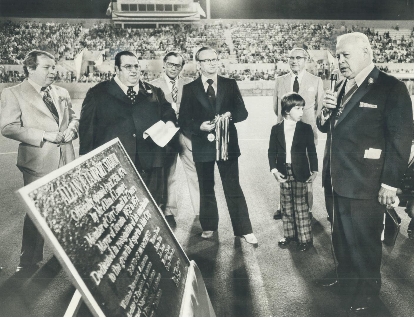 Former mayor Allan Lamport, right tells crowd he's a proud and humble man last night at opening ceremonies dedicating Allan A