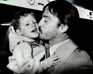 Kiss from dad: 'Where have you been, Dad?' Mathew, 2, may well ask Bunny Larocque as the former Leaf and current Flyer arrived for game