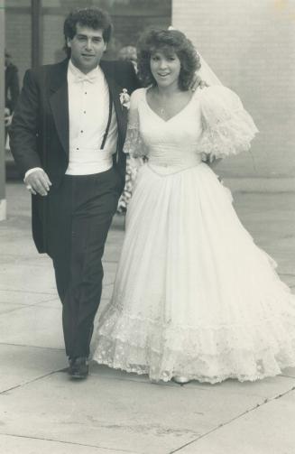 Marilyn and Mel Lastman wipe tears from their eyes, and newlyweds Blayne, 26, and Adrienne, 23, leave Beth Tzedec Synagogue after wedding ceremony.