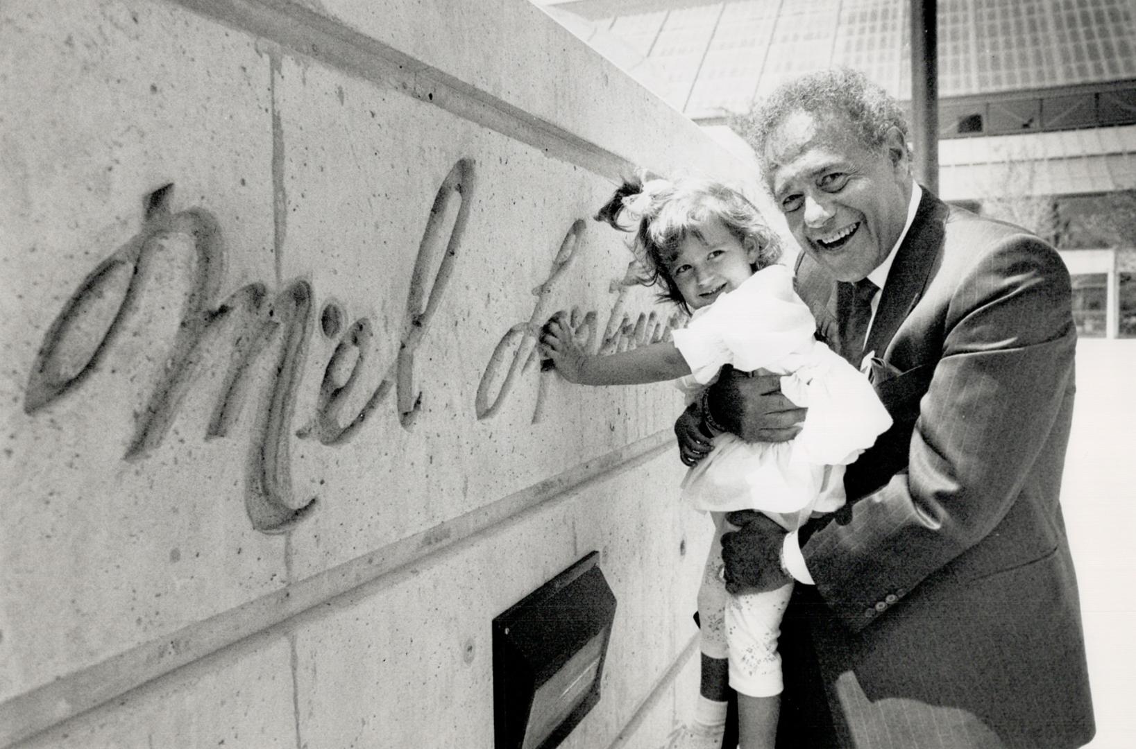 Mel and Belle: North York Mayor Mel Lastman shows granddaughter Brie that he's put his mark on new square.