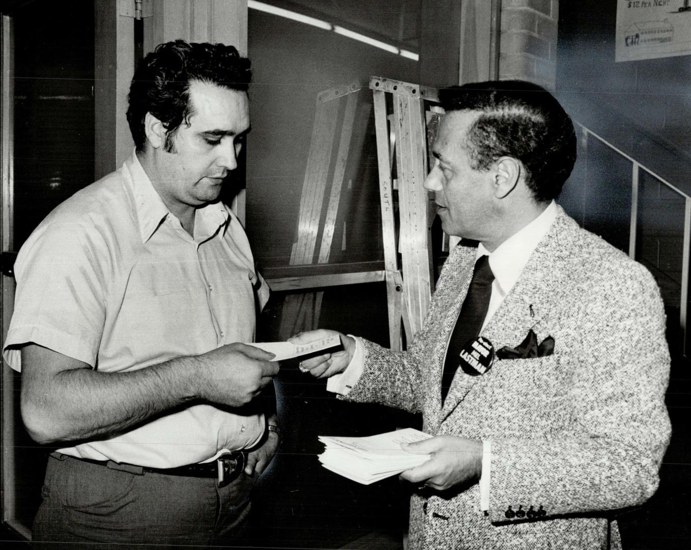 Confident: North York Mayor Mel Lastman, handing out campaign literature to caretaker Peter Triolo, is seeking his fifth term as mayor.