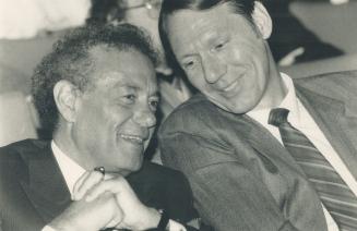 The onlookers: North York Mayor Mel Lastman, left, shares a word with East York Mayor Dave Johnson at forum.