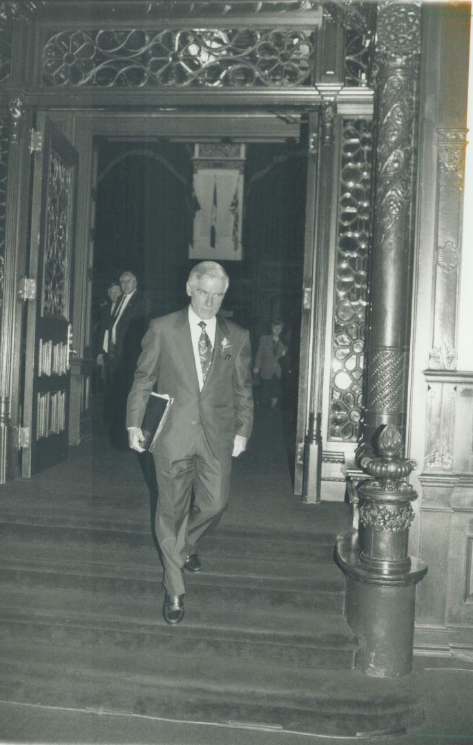 Mission accomplished: Ontario Treassurer Floyd Laughren leaves the Legislature yesterday after delivering the grim news contained in his second budget