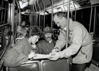 Hands off: Steetcar passengers Carol Nisbet and Byron Zorzos, centre, listen as Toronto Councillor Jack Layton explains a petition urging the Toronto Transit Commission not to cut all-night service