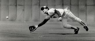 One that got away: Right fielder Rick Leach can't come up with Jose Canseco's wind-assisted belt in third inning but Jays survived this threat.