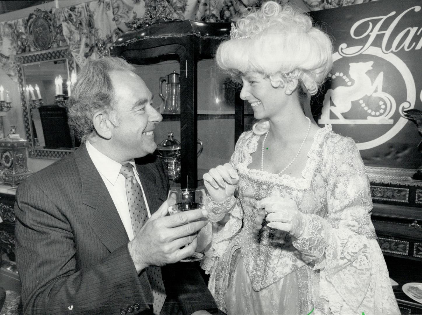 Let them eat caviar, Robin Leach, host of the television show Lifestyles of the Rich and Famous, chats up Marie Antoinette (Caroline Kenny) at the Connoisseur Showplace at the Metro Convention Centre yesterday