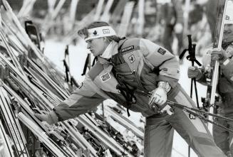 On form: Kerrin Lee-Gartner retrieves skis at Collingwood, above, and the champion downhiller competes in giant slalom, right.