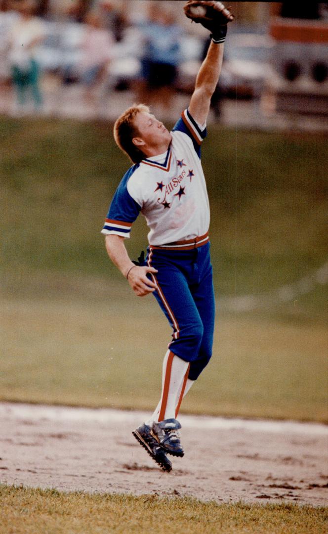 Just call him Scoop: Maple Leafs star Gary Leeman snags a hard smash in last night's charity slo-pitch game against the 31 Division police at Talbot Park