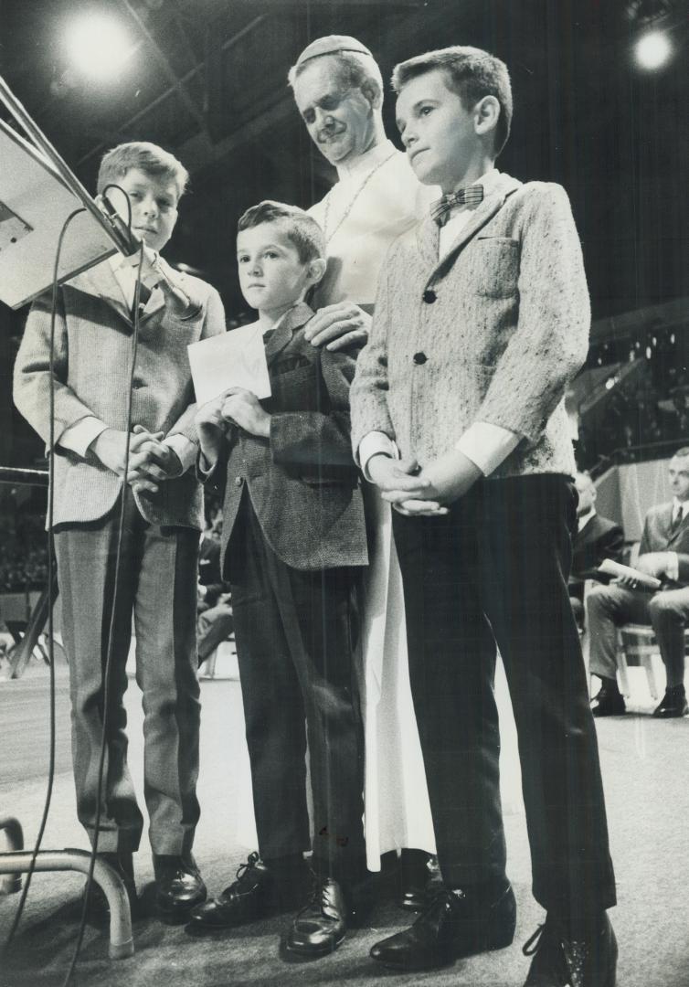 Help for lepers: Paul-Emile Cardinal Leger, former Bishop of Montreal who is now helping African lepers, accepts gifts from, left, Tom Denomme, brother Ronald, and Douglas Kennedy, pupils of Kitchener's Sacred Heart School