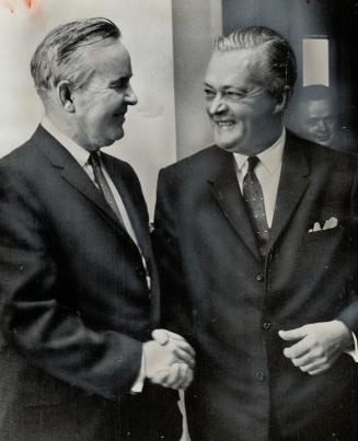 Warm greeting is given: Quebec Premier Jean Lesage by Prime Minister Pearson at a pre-meeting talk between the two