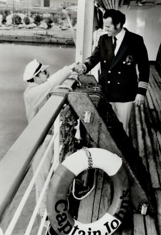 Tying the knot: Joe Olive, left, of Scarborough, hitched his sailboat M'Lady to Captain John's floating Jadran restaurant yesterday, then climbed a 20-foot rope ladder and wed Brenda Banks on board