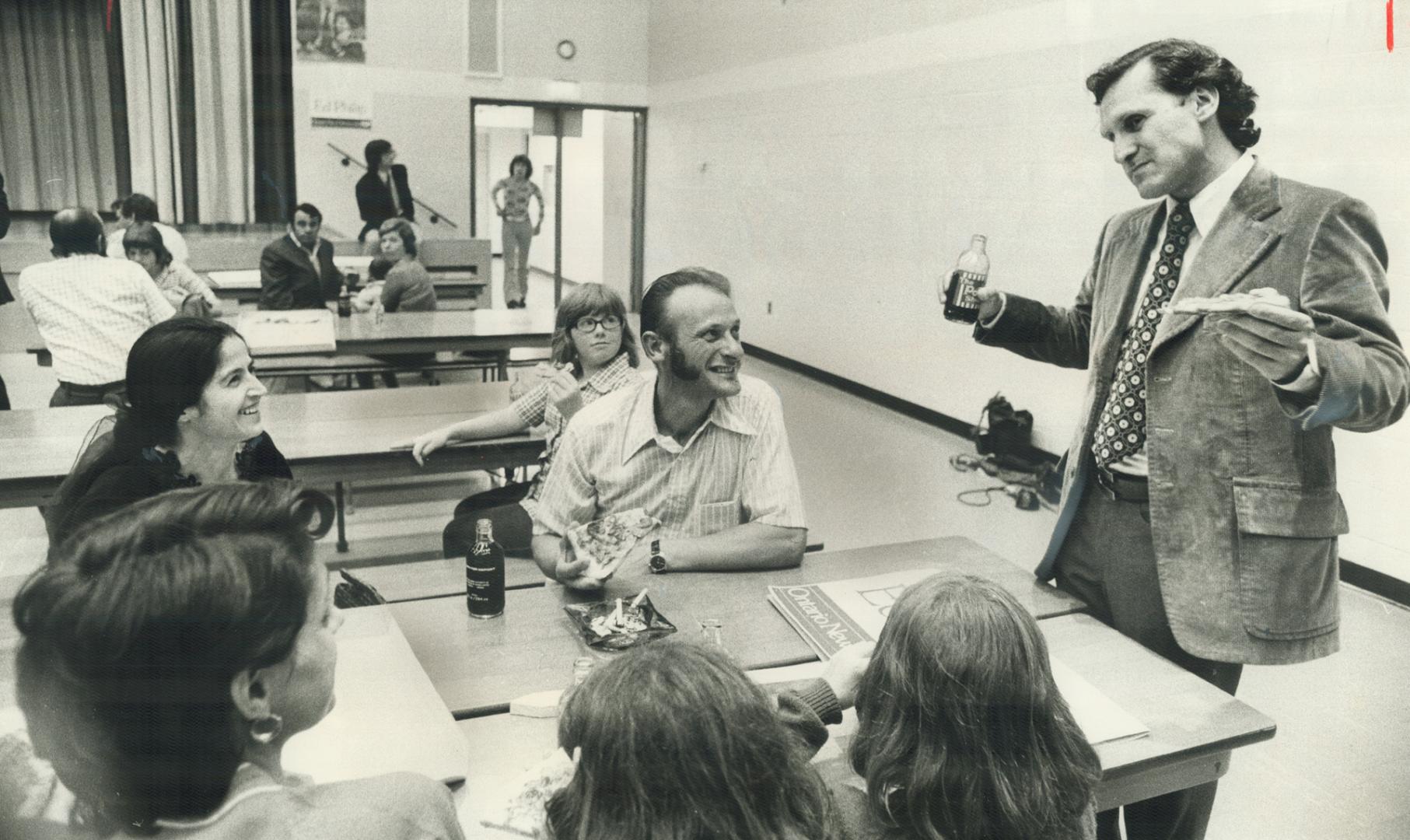 On the one hand, it was pizza, in the other, a bottle of pop, but the central issue was politics as Stephen Lewis, leader of New Democratic Party, spoke to voters and youngsters yesterday at a meeting in G