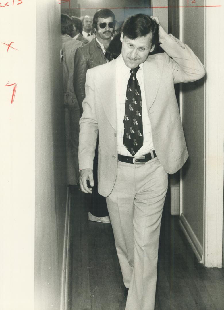 A subdued Stephen Lewis leaves his Scarborough West headquarters last night after learning his New Democrats no longer are the Official Opposition in the Legislature