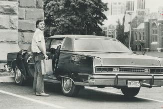 Ontario NDP leader Stephen Lewis gets into his limousine, provided by the provincial government