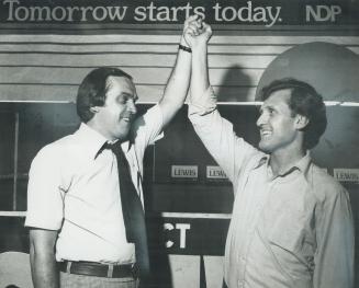 Nominated to defend his seat in Scarborough West, Ontario NDP Leader Stephen Lewis (right) has his arm held aloft in victory by the national party leader, Ed Broadbent, yesterday in Lewis headquarters on Danforth Ave