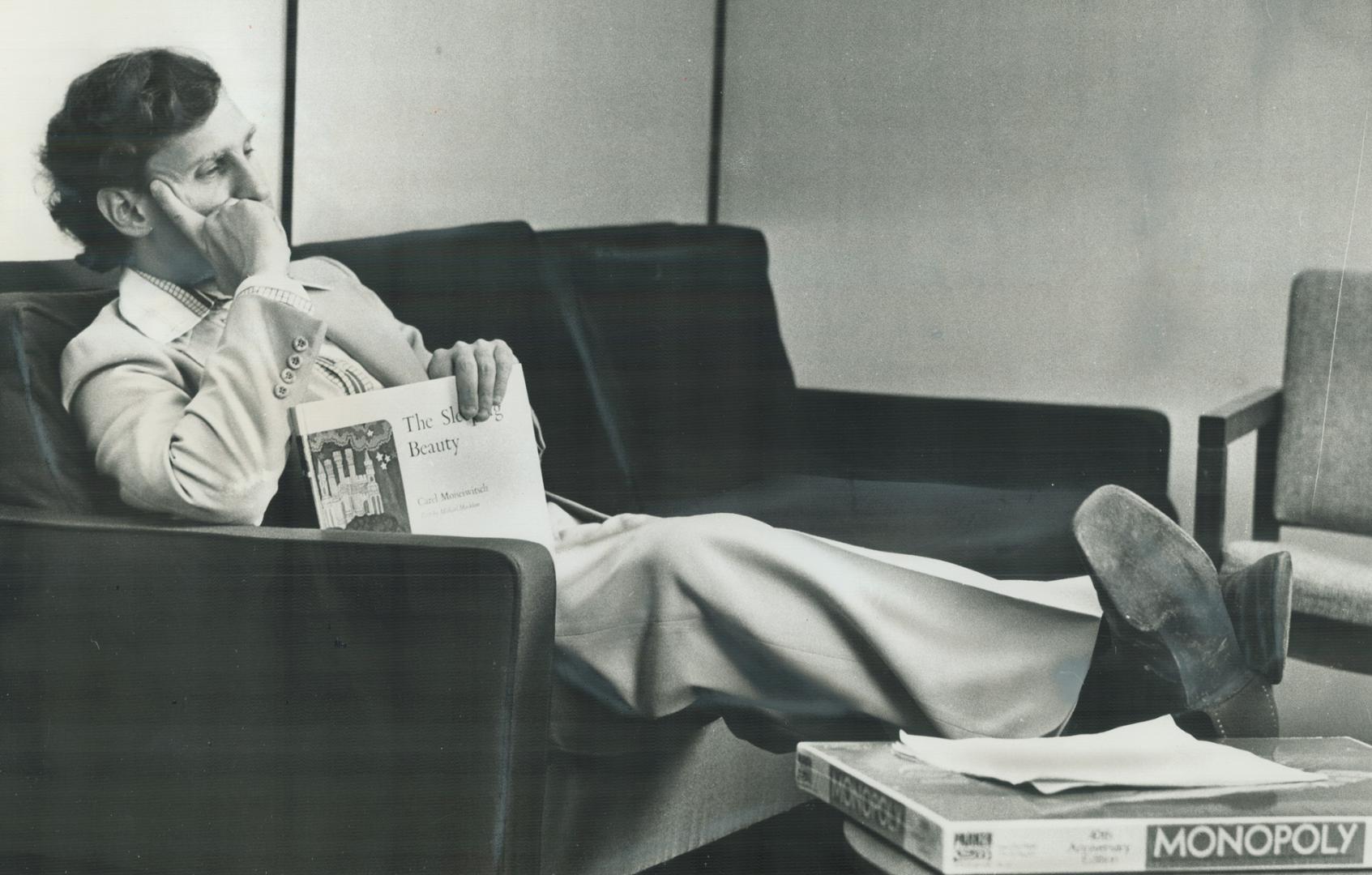 Relaxing in his office with a book in his hand and a Monopoly game at his feet-victory gifts from supporters-New Democratic Party Leader Stephen Lewis appears to be contemplating what lies ahead