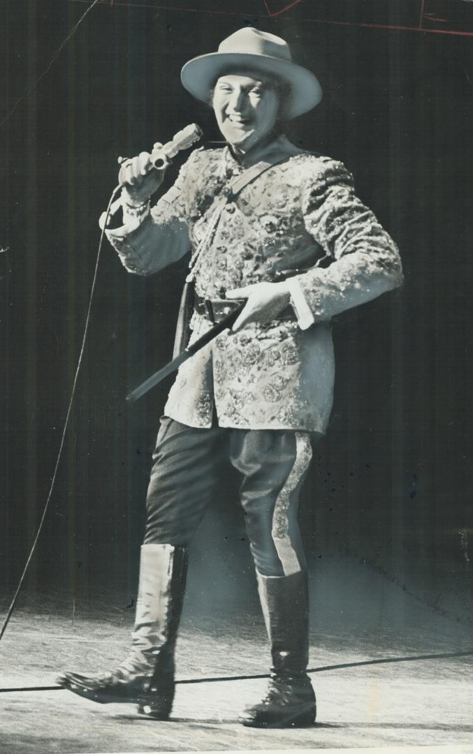 A glittering Mountie suit was pianist Liberace's piece de resistance for his fans at sold-out O'Keefe Centre concert last night