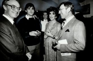 Gina's admirers: Gina Lollobrigida chats at a cocktail party at Toronto's Italian Consulate last night before the start of an Italian film festival