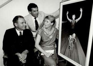 Lovell still a hero. Jocelyn Lovell, left, former world-class cyclist, admires a painting of himself done by Tony Kew. He and wife Sylvia Burka-Lovell, along with Dr. Eric Jackman, attended a reception in his honor at the Canadian Sports Hall of Fame yest