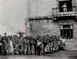 MacArthur waits in a balcony window for Japanese to come and surrender