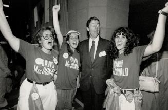 Victory whoop: Margaret McKeown, left, Mary Creatura and, right, Catia Creatura help David MacDonald celebrate his 51-vote, second-ballot victory over businessman Doug McCutcheon for the Tory nomination in Rosedale last night