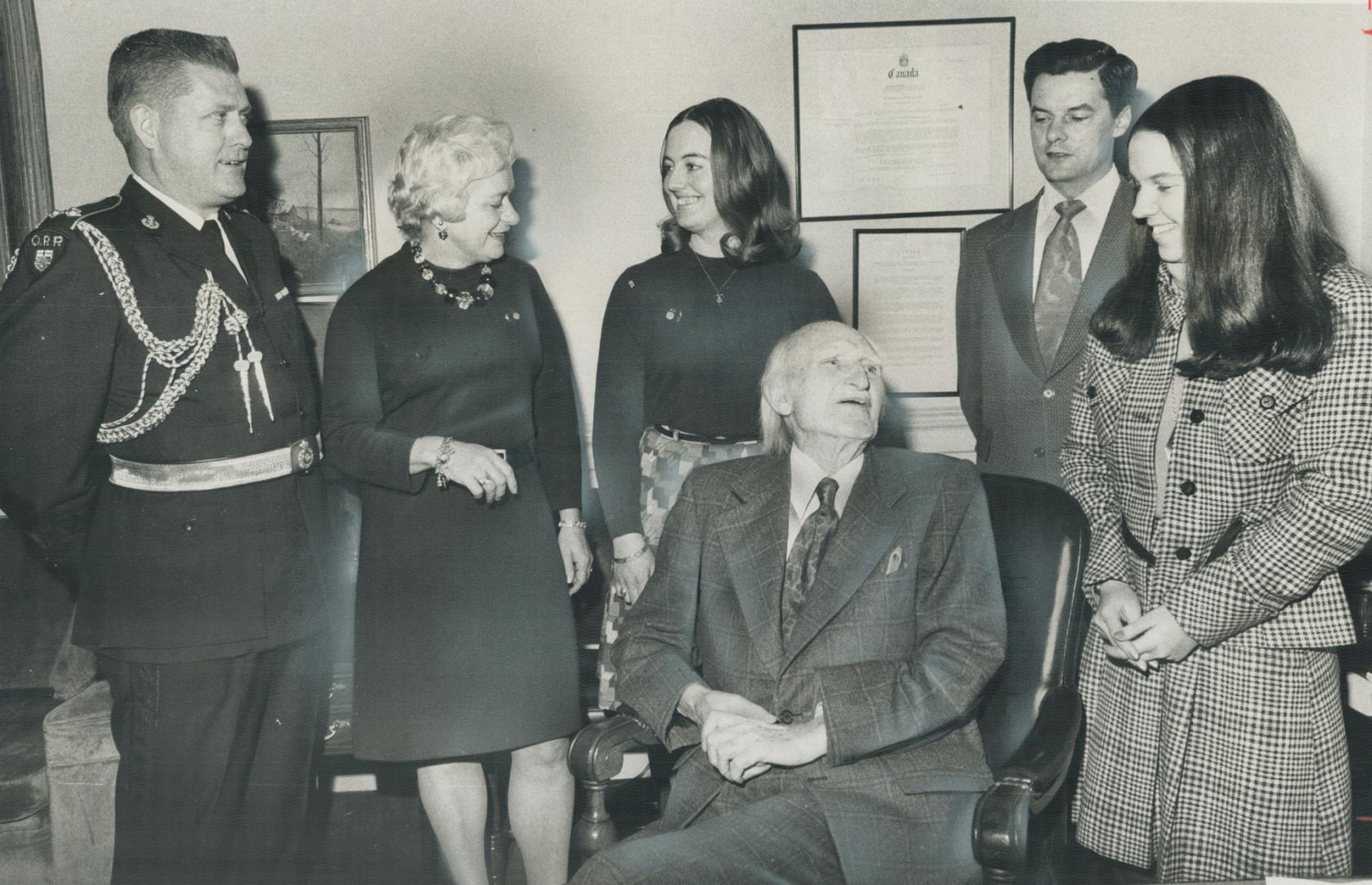 With his last act a Lieutenant-Governor - reading the Throne Speech scheduled for tomorrow, 82-year-old Ross Macdonald sits in his luxurious suite at Queen's Park surrounded by members of his staff (from the left): Chief Inspector J