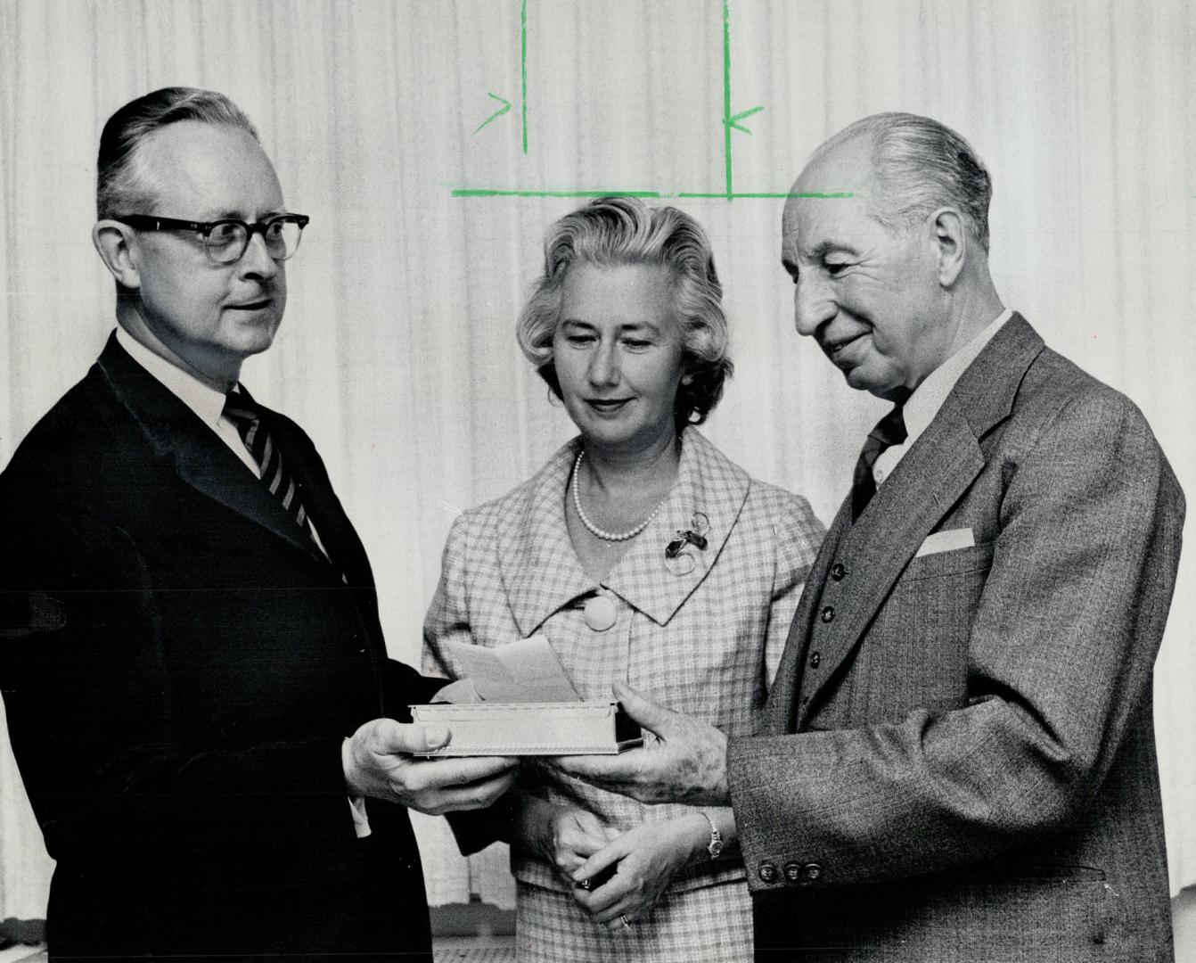 Hon. J. Keiller Mackay, patron of Shakespeare Society of Toronto was presented with life membership by Prof. John W. Dodd, Mrs. Mackay watches.