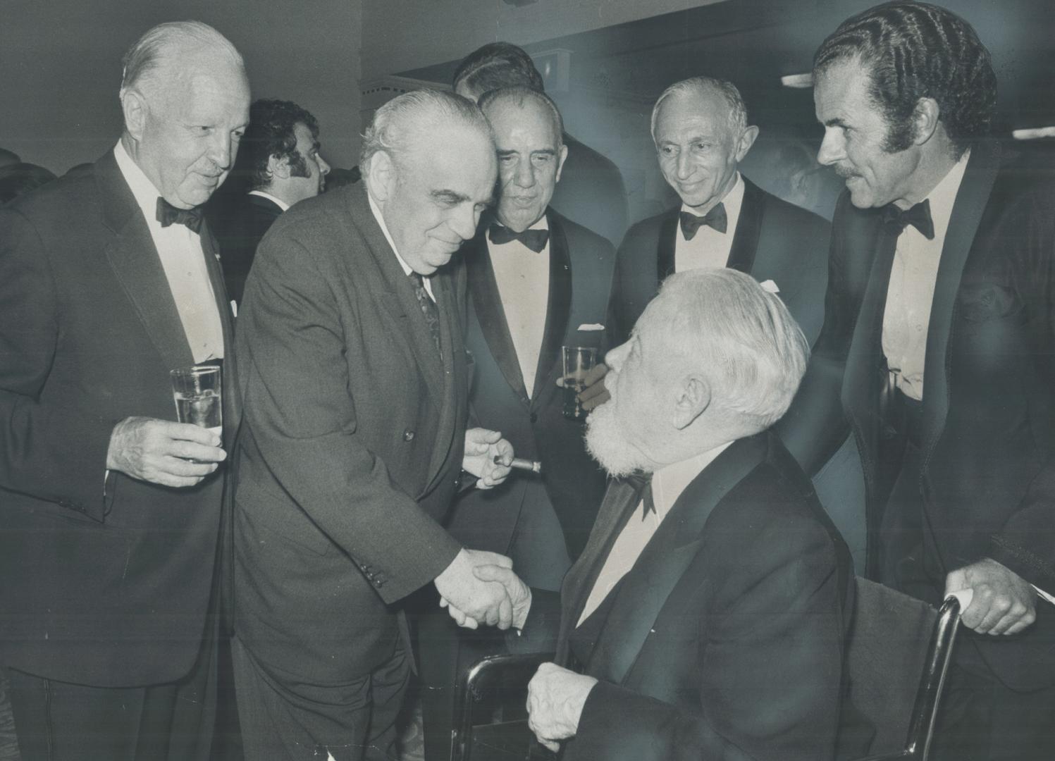 Major figures in the arts gathered at the Royal York Hotel last night to pay tribute to the dean of Canadian music Sir Ernest MacMillan (at centre in wheelchair)